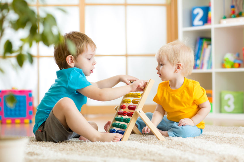 35708967 - children boys play with abacus toy indoors